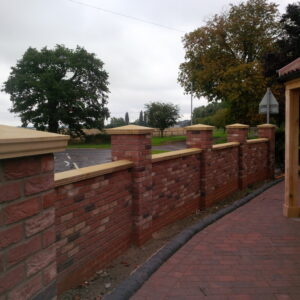 Coping stones on top of a brick wall 