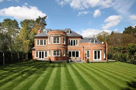 Luxury home featuring cast stone window surrounds