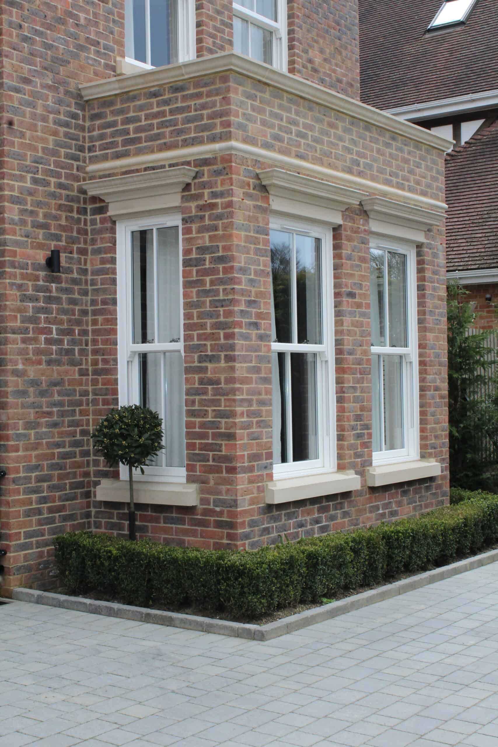 350mm cast stone coping stones above a brick wall