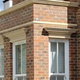 Cast Stone Heads on Windows